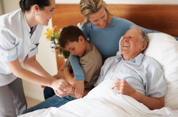 Home Health Aide Assisting Hospice Patient and Family