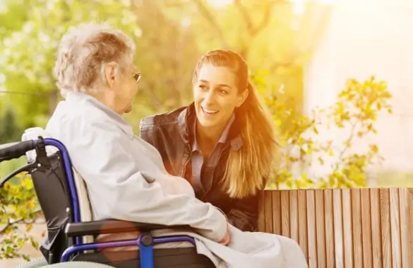 Daughter communicating with hospice care parent
