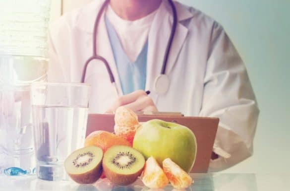 Hospice doctor next to food and liquids on a table