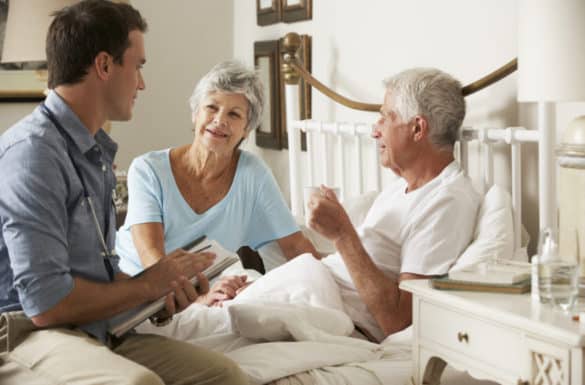 Doctor on home visit trying to set up hospice care